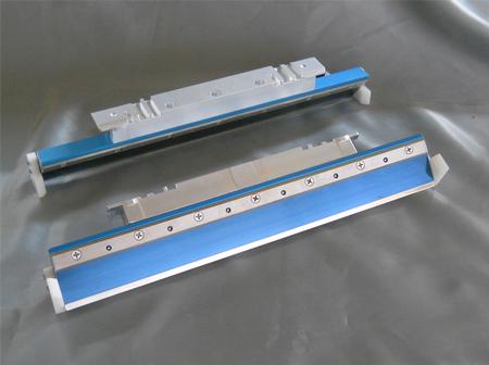 Pictured is a pair of Universal Permalex holder and blade assemblies for Ekra Serio Users.