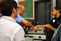 Hands-on instruction during a recent paste-place-reflow workshop at DDM Novastar.